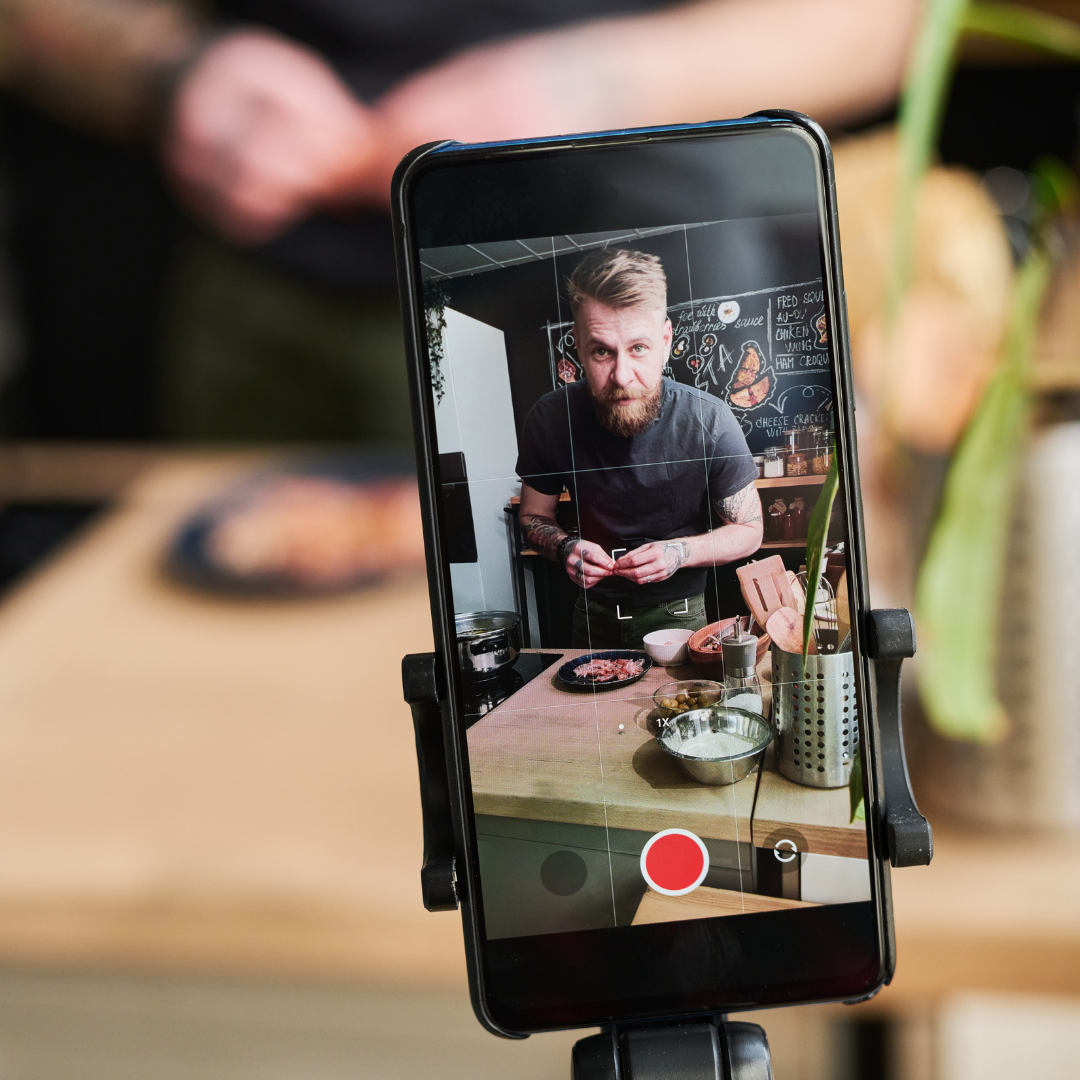 Business owner recording a video for user-generated content, showcasing authentic engagement